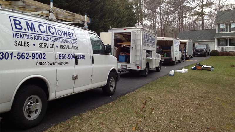 B.M.C./Clower Vans in driveway 